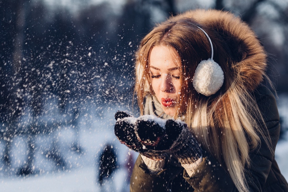 girl in snow enjoy the holidays with braces in Charleston SC